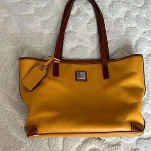 Authentic Dooney and Bourke pebbled, leather tote in mustard, yellow and tan